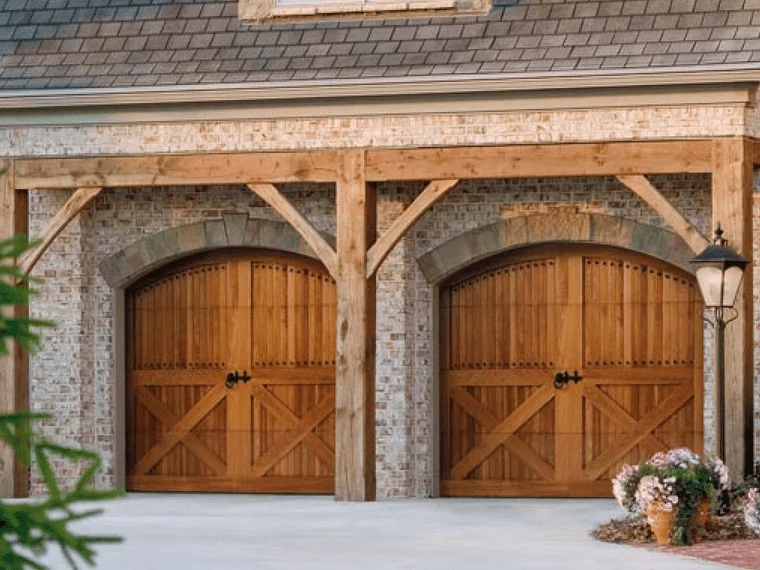Wood carriage garage doors with natural finish
