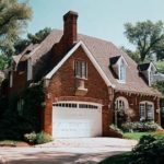 brick house with white garage door
