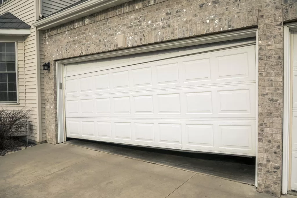 A crooked garage door with gap near bottom. Why is My Garage Door Crooked