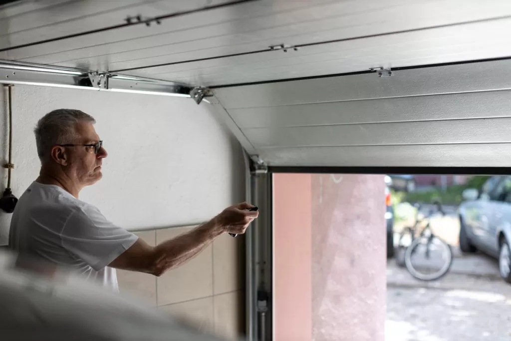 man watching garage door shaking when closing