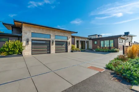 The Top Design Trends in Luxury Modern Garage Doors for 2026 What Garage Doors Are in Style Right Now? - Mixed-Material Garage Doors